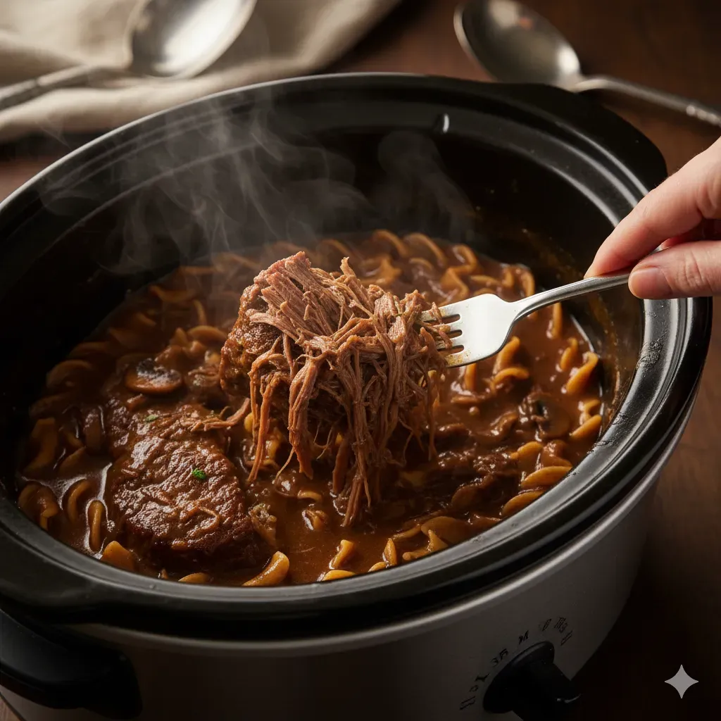 shredding crockpot beef and noodles